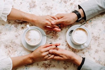 a pair of lovers holding hands,romantic
