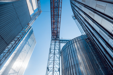 Naklejka premium Modern silos for storing grain harvest. Agriculture.