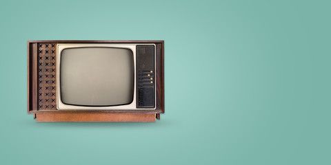 Retro television - old vintage tv on color background. retro technology. flat lay, top view hero...