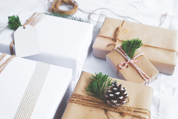 Christmas background - Craft and handmade Christmas present (gift boxes) and rustic decoration. Vintage style. Selective focus and shallow.