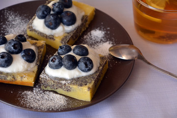 Summer dessert with ground poppy, blueberries and cottage cheese.