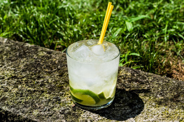 Caipirinha Cocktail with lime and ice.