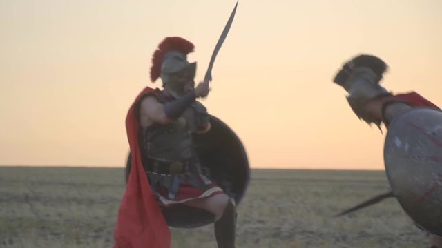 The battle of two Roman soldiers in the field before dawn, slow motion
