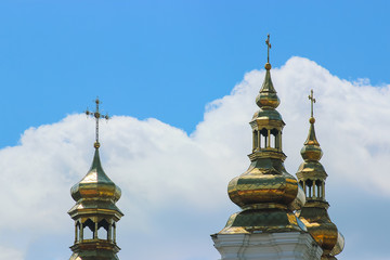 Fototapeta na wymiar Golden cross on the church roof
