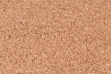 Light brown cork wood panel background.