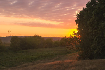 Fototapeta premium Evening in the hill surrounded by meadow