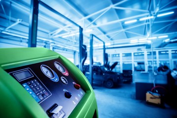 Servicing car air conditioner. Service station.