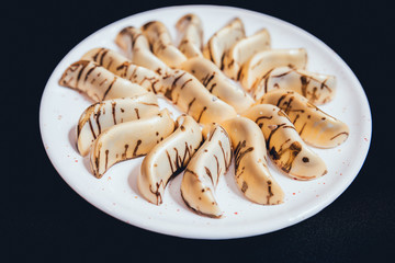 Dessert with cream on the wihte plate