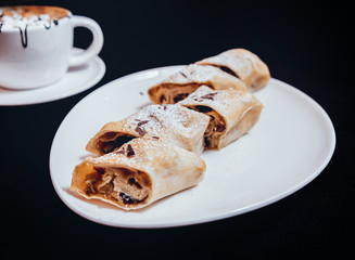 Homemade apple pies decorated with chocolate