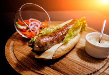 Grilled chicken seekh kebab with fresh bun and cheese.