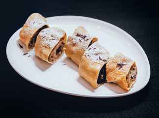 Homemade apple pies decorated with chocolate