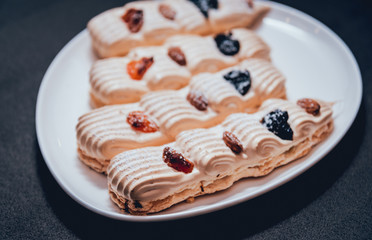 French meringue cookies on the white plate.