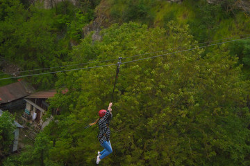 Obraz premium Child ride down in Rope Park