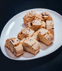 French cookies with jam on the white plate.