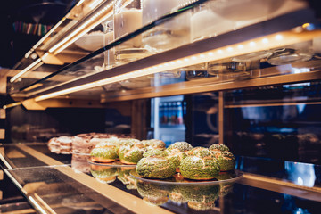 Sweets and cakes in showcase. Italian pastry shop. Cakes with fruits, berries and chokolate