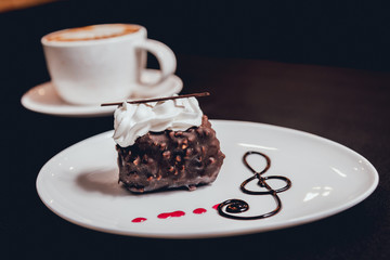 Dessert with cream on the wihte plate