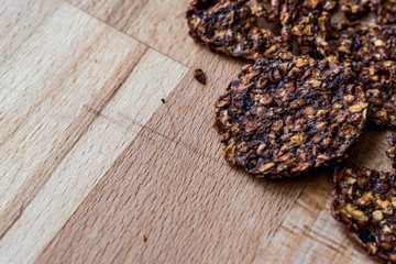 Apple and Cinnamon Chips on wooden surface.