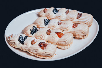 French meringue cookies on the white plate.