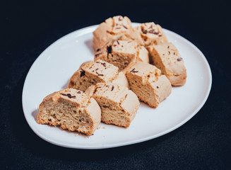 French cookies with jam on the white plate.