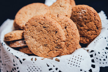 French cookies with jam on the white plate.