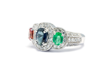 Closed up Emerald, Blue Sapphire and Pink Diamond with white diamond and Platinum ring