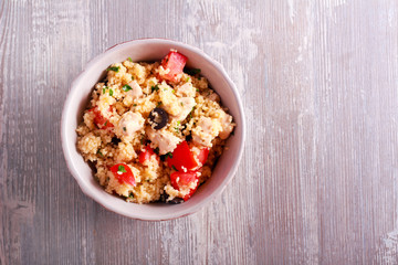 Couscous, chicken, tomato, olive and parsley salad