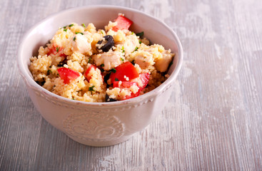 Couscous, chicken, tomato, olive and parsley salad