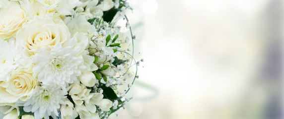 White wedding bouquet border with roses with copy space on gray background banner