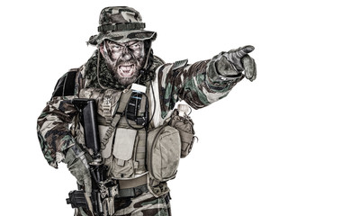 Fototapeta premium United States Commando half length studio shot. Mouth opened, soldier yelling, emitting intiminate formidable frightening scream pointing finger target and giving attack direction to subordinates