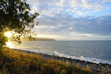Sunset over the sea off the Captain Cook Highway between Cairns and Mossman in Far North Queensland, Australia