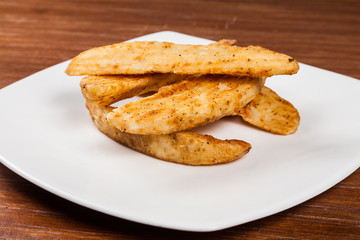 portion of french fries on a white plate