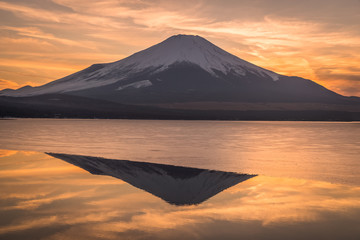 Mountain Fuji and Yamanakako ice lake with reflection in evening winter