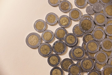 a lot of mexican pesos coins background