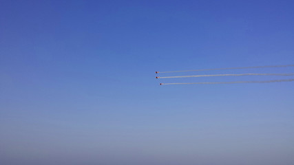 Air show. Airplanes with smoke trails in the sky