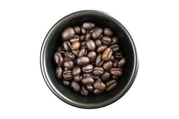 Coffee beans in a black bowl isolated on white background