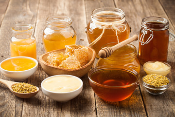 Various honey on wooden table