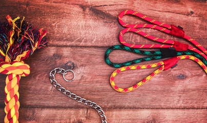 Pet accessories on wooden background. Top view. Pets and animals concept