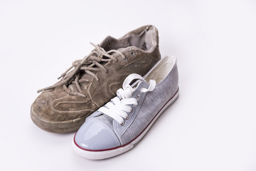 New and old sneaker side by side on white background