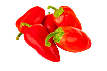 Five of peppers lie in a pile on a white background.