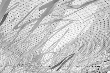 Abstract black and white motion blur ribbon and net background.