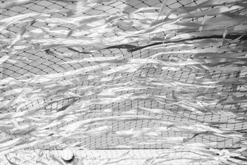 Abstract black and white motion blur ribbon and net background.