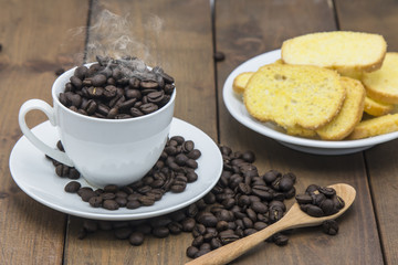 coffee beans in a coffee cup on a wooden floor