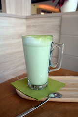 Matcha latte. Organic green tea on a glass cup. 