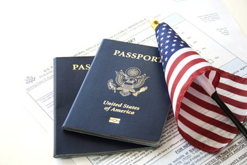 Immigration concept (Passport renewal form, passports and flag)