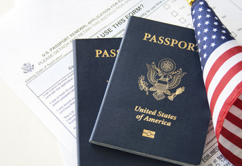 Immigration concept (Passport renewal form, passports and flag)