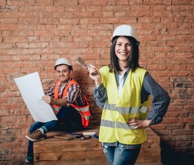 Happy couple making repairs to their home.