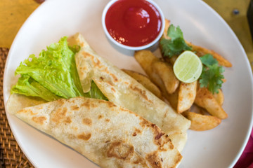 Homemade Quesadilla with chicken in the plate close-up shot, Bali island, Indonesia.