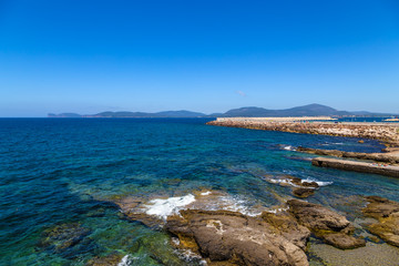 Fototapeta premium Alghero, Sardinia, Italy. Picturesque shore and port dike