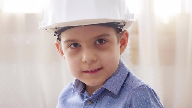 Boy wearing construction helmet