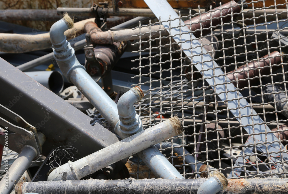 Wall mural iron pipes in the landfill of recyclable material